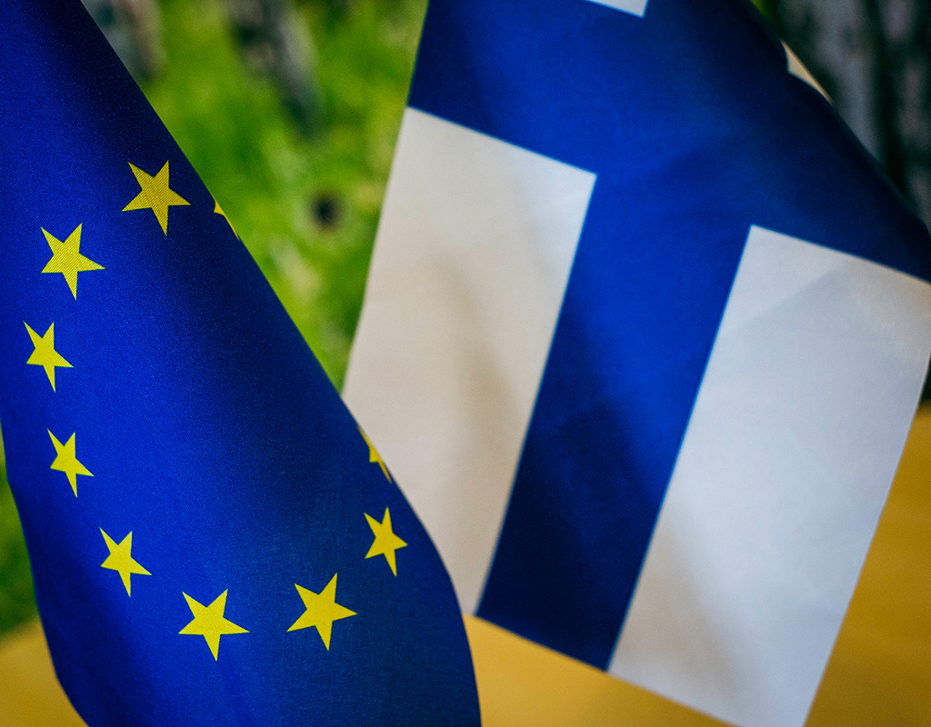 Finland and EU flags on a table